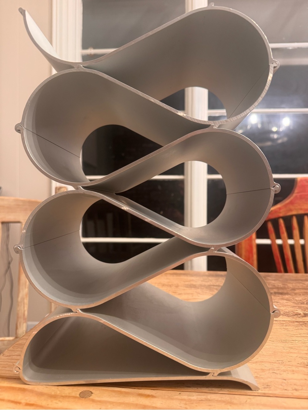 Echelon Wine Rack is a modular bottle storage system made from aluminum
